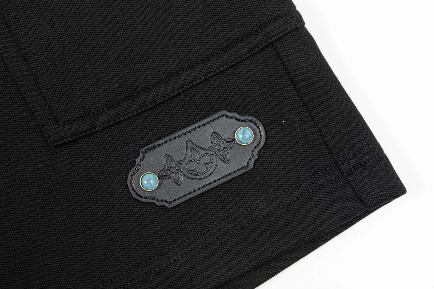 Short à boucle turquoise